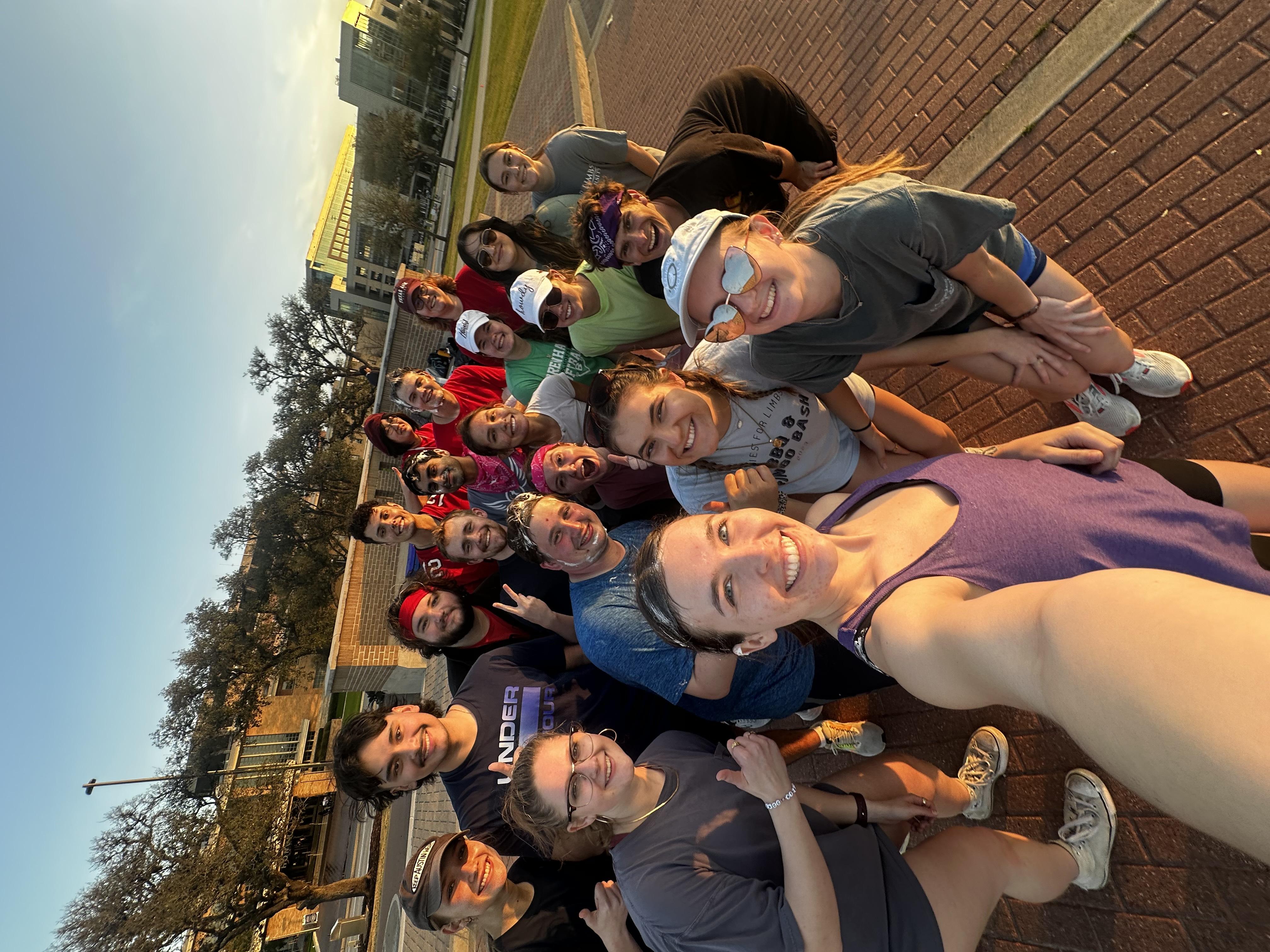 Social Committee in action - Group selfie of AFL members at sunset showing the friendly, social atmosphere of the organization